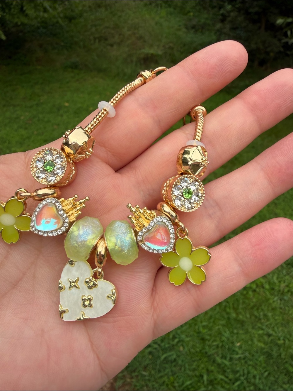 Gold-Tone Charm Bracelet with Green Flower and Iridescent Heart Charms